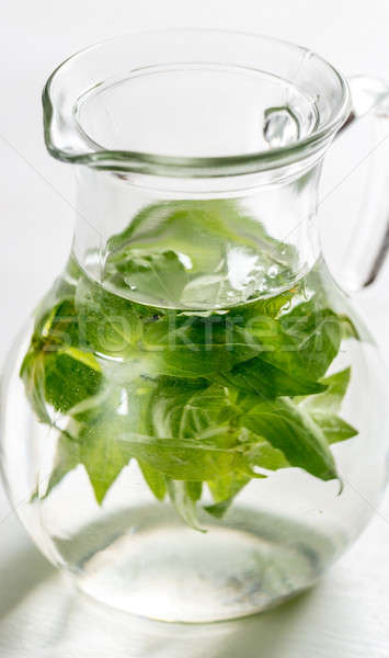 Water with fresh basil in the glass jug Stock photo © Alex9500