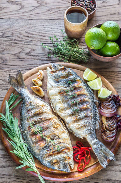 Grilled Dorade Royale Fish on the wooden board Stock photo © Alex9500