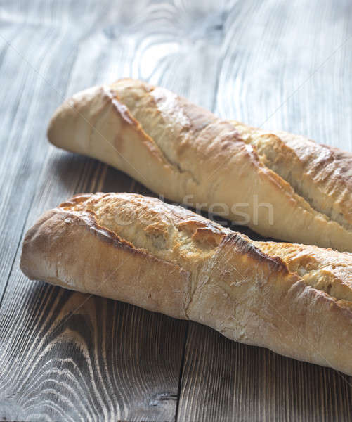 Foto stock: Dos · baguettes · desayuno · blanco · estudio