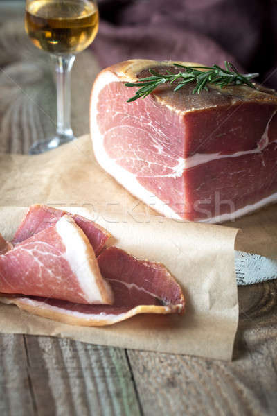 Prosciutto with fresh rosemary on the wooden board Stock photo © Alex9500