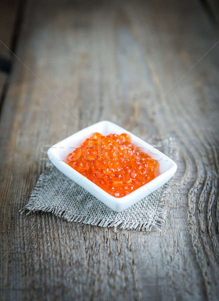Bowl of red caviar on the wooden table Stock photo © Alex9500