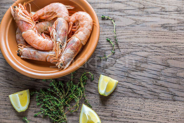 Raw shrimps with lemon wedges Stock photo © Alex9500