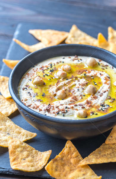 Bowl of hummus with tortilla chips Stock photo © Alex9500