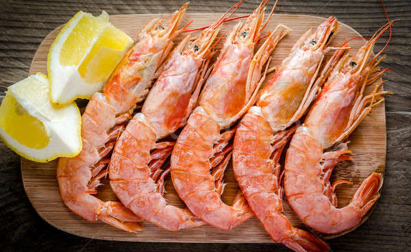 Shrimps on the wooden board Stock photo © Alex9500