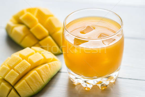 Mango juice on the wooden table Stock photo © Alex9500