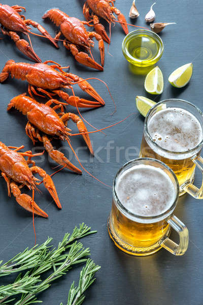 Boiled crayfish with two mugs of beer Stock photo © Alex9500