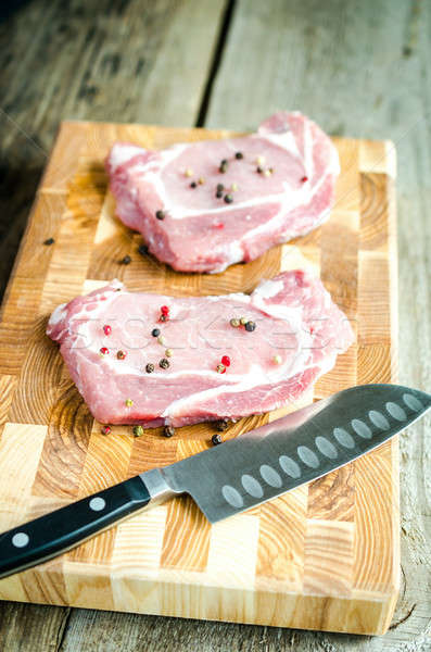 Crudo cerdo rojo cuchillo grasa bordo Foto stock © Alex9500