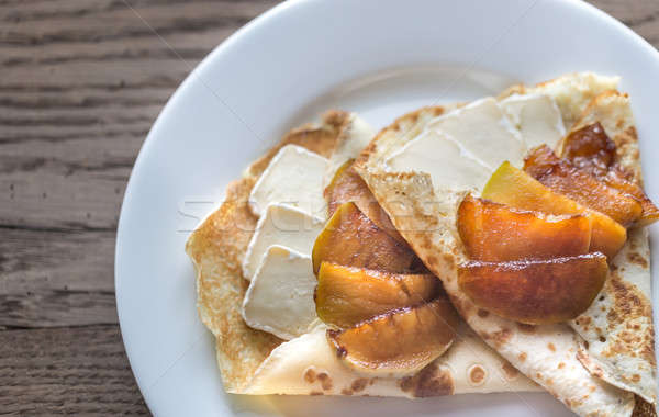 Stock photo: Crepes with brie and caramelized slices of apple