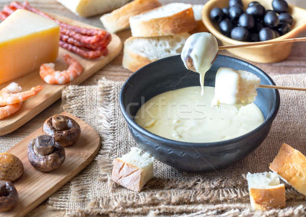 Bowl of fondue with appetizers Stock photo © Alex9500