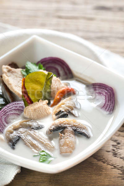 Bowl of thai tom kha kai soup Stock photo © Alex9500