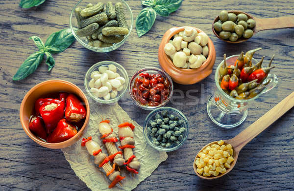 Pickled vegetables on the wooden background Stock photo © Alex9500