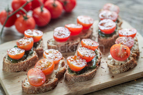 Toasts with tahini and mint sauce and cherry tomatoes Stock photo © Alex9500