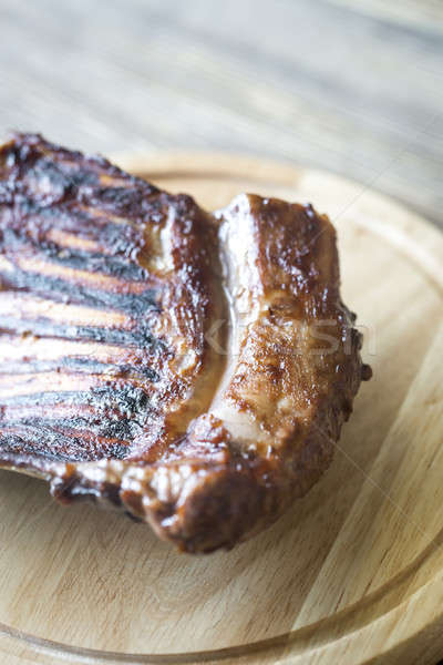 Stock photo: Grilled lamb ribs on the wooden board