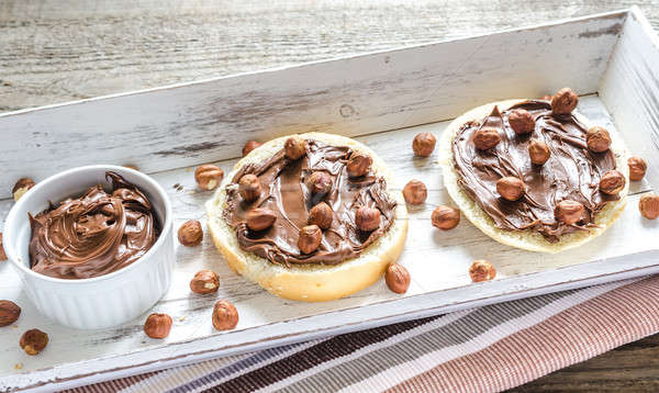 Bun slices with chocolate cream and nuts Stock photo © Alex9500