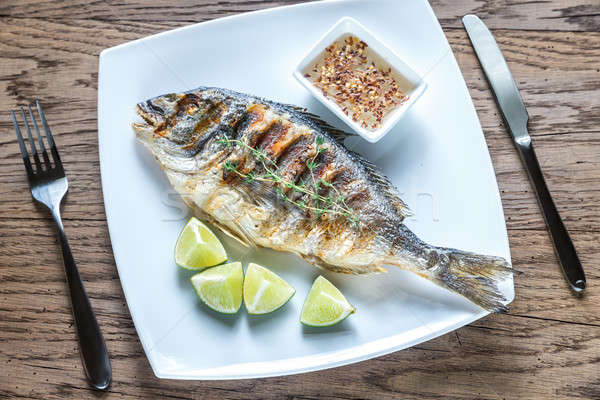 Grilled Dorade Royale Fish on the plate Stock photo © Alex9500