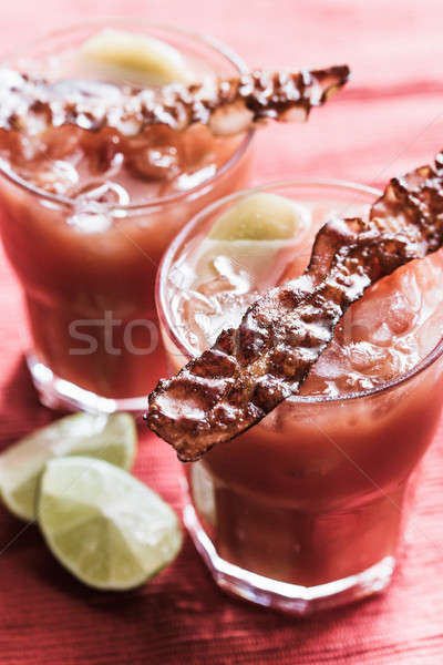 Two glasses of Bloody Mary with bacon rashers Stock photo © Alex9500