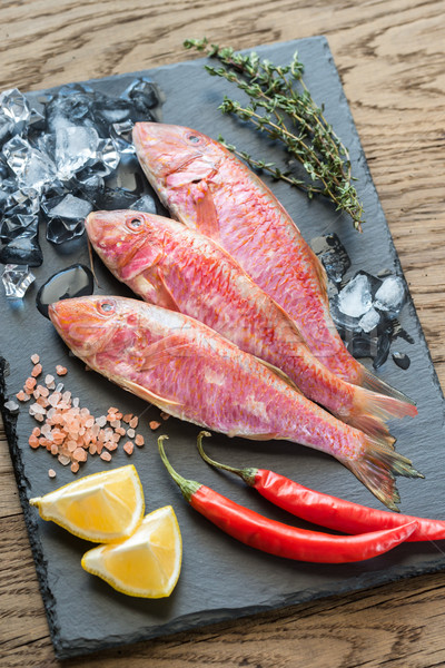 Raw red mullet with ingredients Stock photo © Alex9500