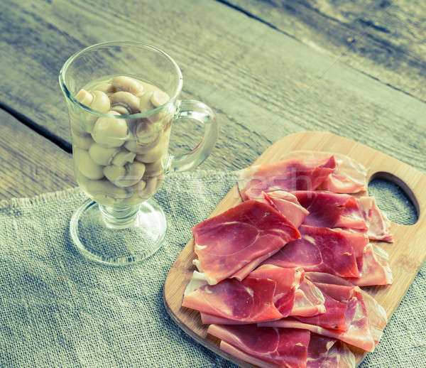 Slices of jamon on the wooden board Stock photo © Alex9500