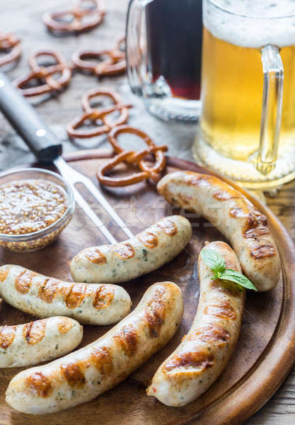 Grilled sausages with pretzels and mugs of beer Stock photo © Alex9500