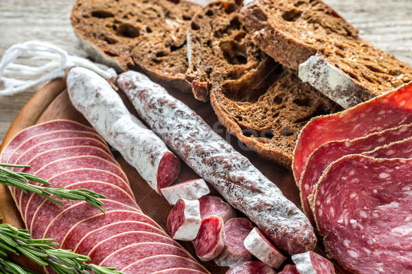 Different kinds of salami with dark-rye bread Stock photo © Alex9500