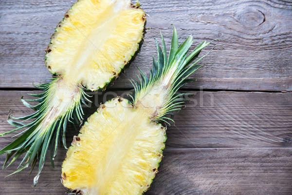 Pineapple on the wooden background: cross section Stock photo © Alex9500