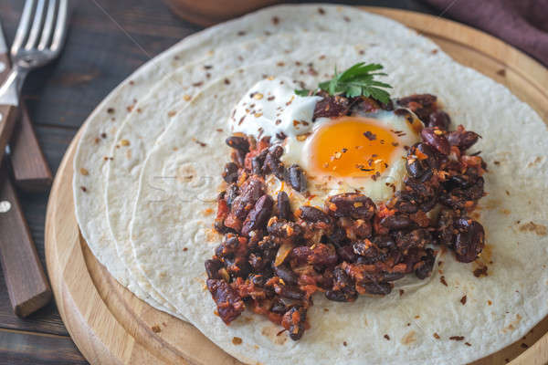 Tortilla with chipotle bean chili and baked egg Stock photo © Alex9500