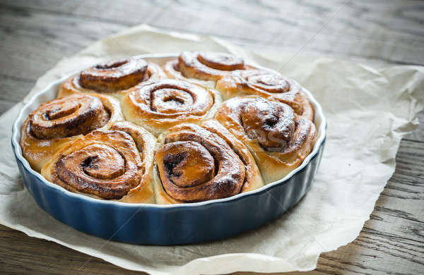 Cinnamon rolls on the wooden background Stock photo © Alex9500