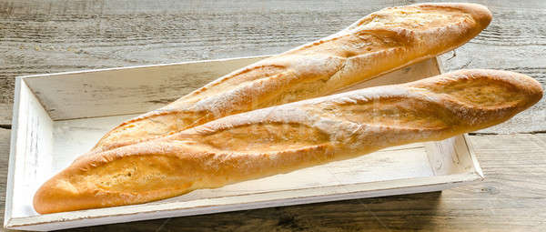 Stock photo: Two baguettes on the wooden tray