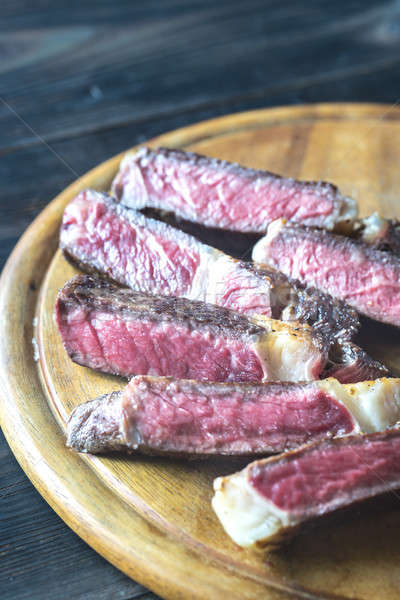 Sliced beef steak on the wooden board Stock photo © Alex9500