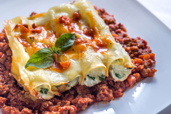Canelloni stuffed with ricotta with bolognese sauce Stock photo © Alex9500