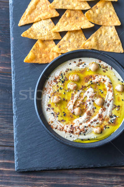 Stock photo: Bowl of hummus with tortilla chips