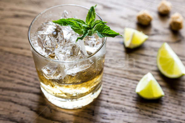 Glass of rum on the wooden background Stock photo © Alex9500