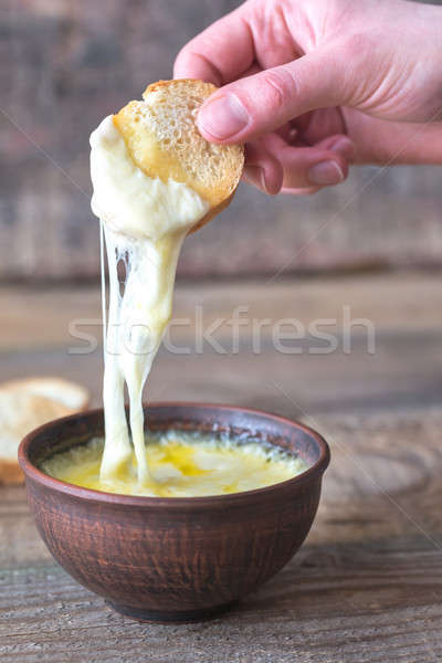 Bowl of cheese dip with toasts Stock photo © Alex9500