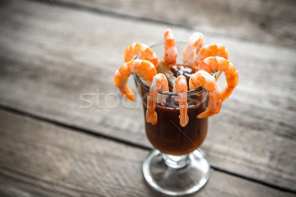Cooked prawns  with tomato sauce on the wooden table Stock photo © Alex9500