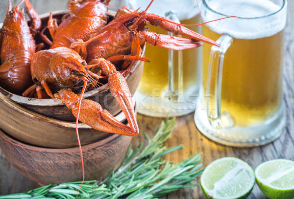 Bowl of boiled crayfish with two mugs of beer Stock photo © Alex9500