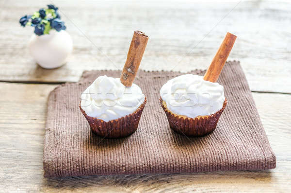Stock photo: Cupcakes with whipped cream and cinnamon
