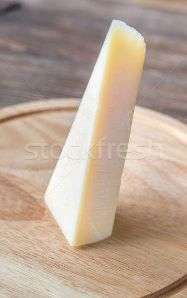 Stock photo: Grana Padano cheese on the wooden board