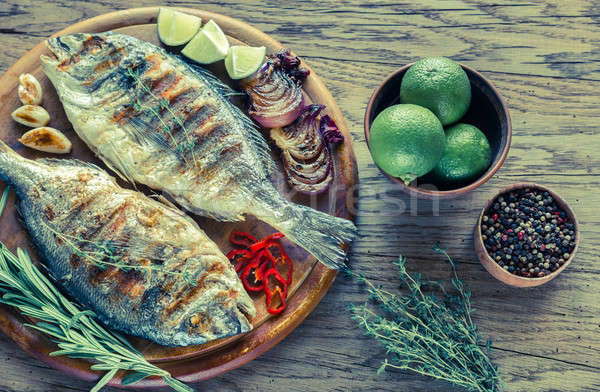 Grilled Dorade Royale Fish on the wooden board Stock photo © Alex9500