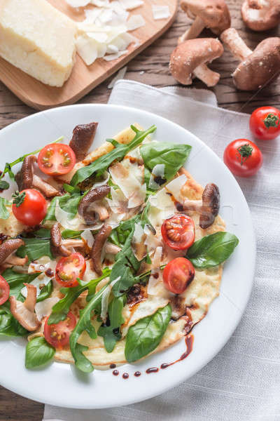 Stock photo: Crepes with cherry tomatoes, cheese, mushrooms and arugula