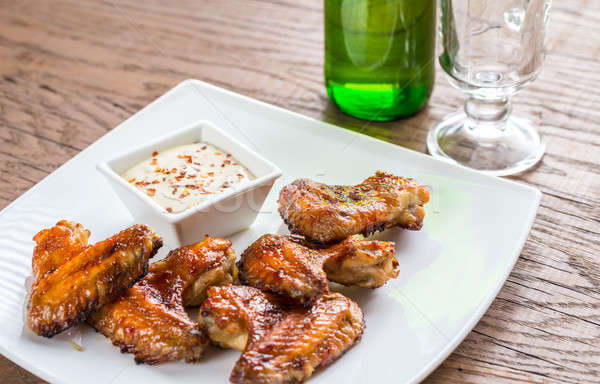 Baked chicken wings with spicy sauce Stock photo © Alex9500