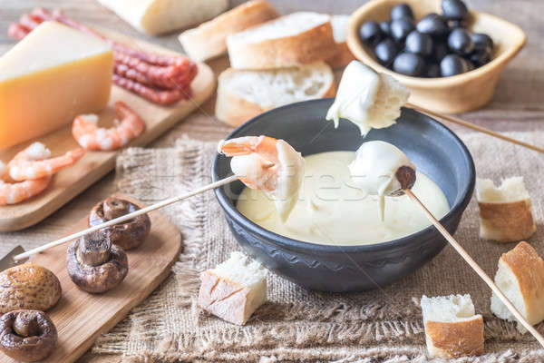 Bowl of fondue with appetizers Stock photo © Alex9500