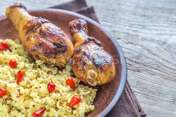 Spicy chicken drumsticks with rice curry Stock photo © Alex9500