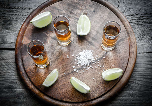 Szemüveg tequila fa deszka gyümölcs asztal bár Stock fotó © Alex9500