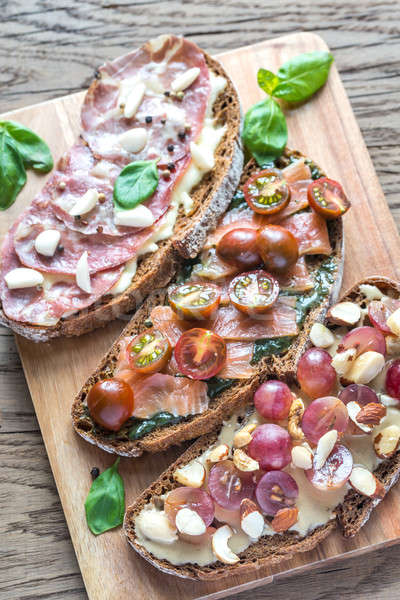 Bruschetta with different toppings Stock photo © Alex9500