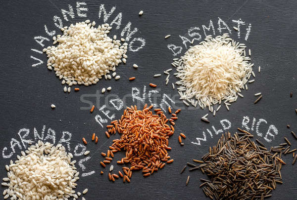 Different kinds of rice on the dark background Stock photo © Alex9500