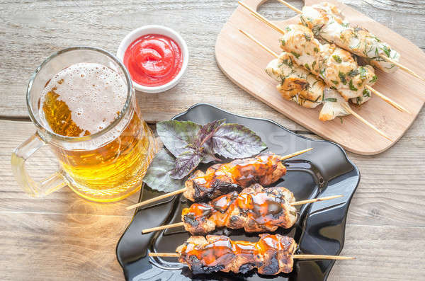 Grilled chicken skewers with herbs and spicy sauce Stock photo © Alex9500