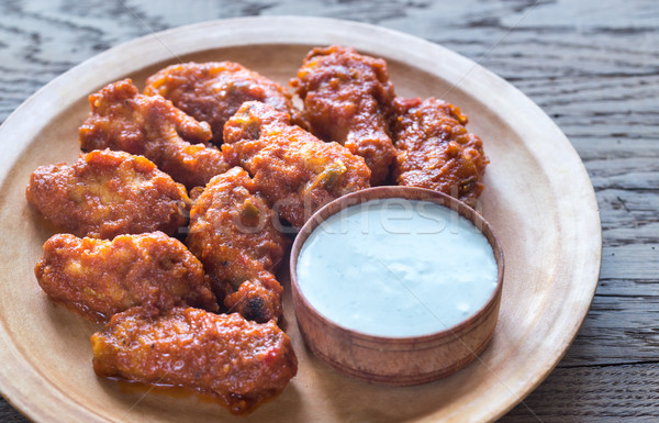 Fried chicken wings with blue cheese sauce Stock photo © Alex9500