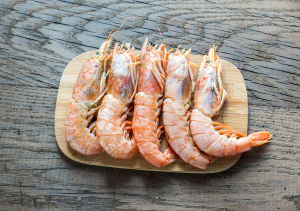 Raw shrimps with lemon wedges Stock photo © Alex9500