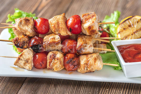 Grilled chicken skewers on the white plate Stock photo © Alex9500