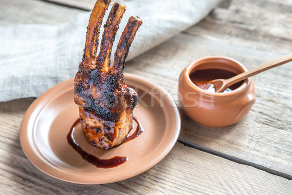 Stock photo: Grilled pork ribs on the wooden background